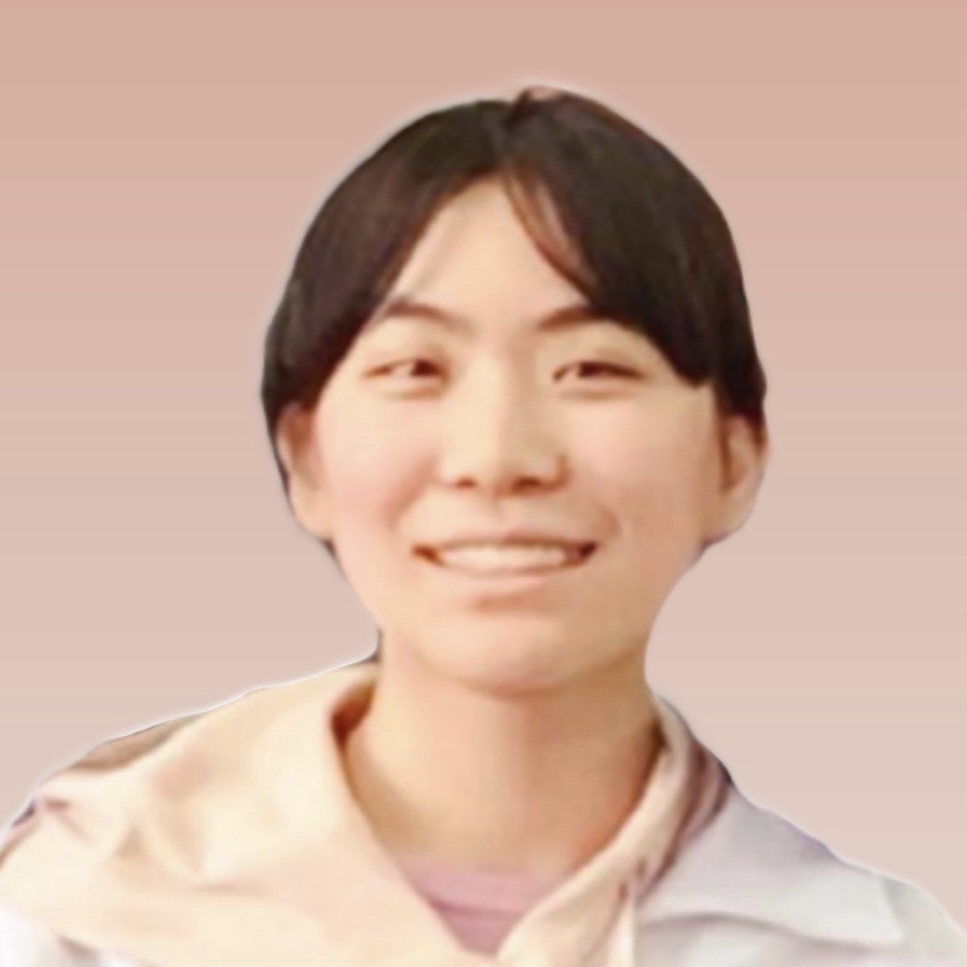 Portrait photo of Yutian (Skylar) Shi, a smiling Ansian girl with brown hair and eyes and wearing a pink hoodie.